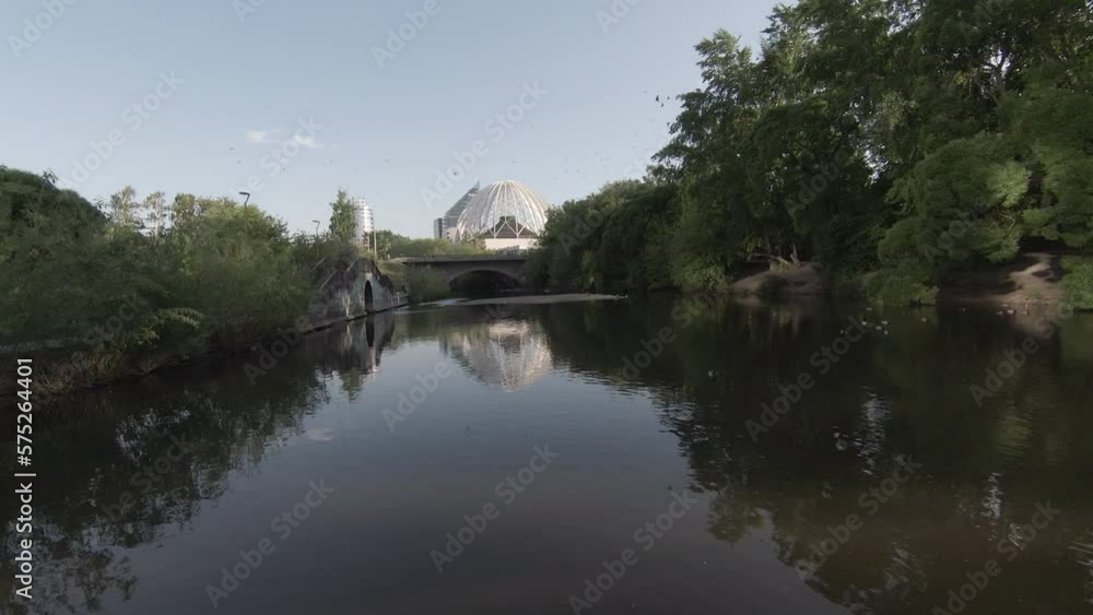 Aerial view river in the city park of Yekaterinburg. Footage. Bird's eye view of the Iset river near the Circus. Rest of people in the park, flights of birds Aerial view river in the city park of Yekaterinburg. Footage. Bird's eye view of the Iset river near the Circus. Rest of people in the park, flights of birds