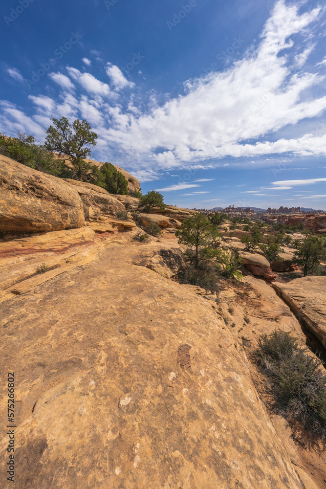 hiking the chesler park loop trail in the needles in canyonlands national park, usa