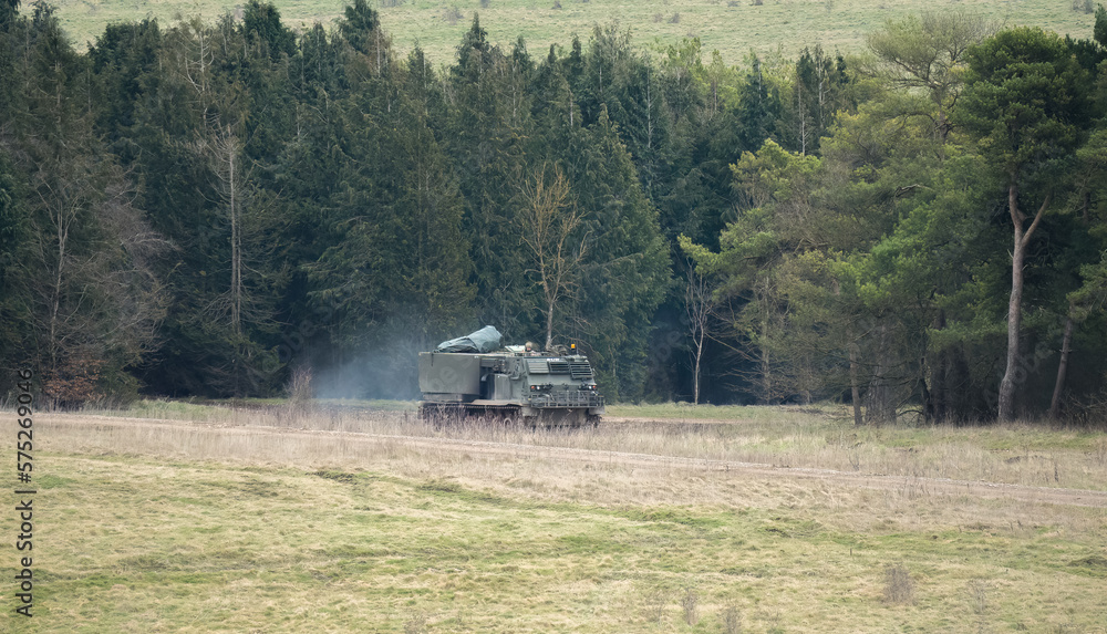 Obraz premium British army self propelled M270 Multiple Launch Rocket System (MLRS) tank unit training Ukranian crew on a military exercise, Wiltshire UK