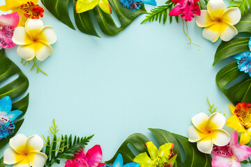 Summer background with tropical orchid flowers and green tropical palm leaves on light background. Flat lay, top view.