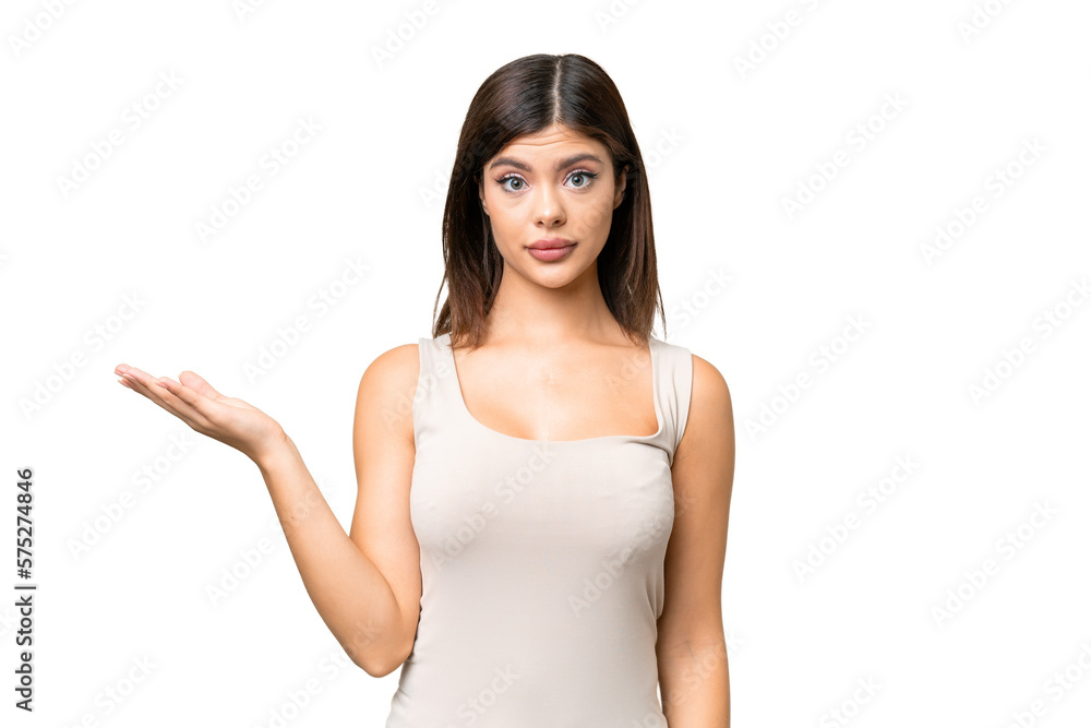 Young Russian woman over isolated chroma key background making doubts gesture Young Russian woman over isolated chroma key background making doubts gesture