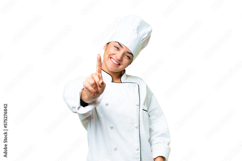 Young woman Chef over isolated chroma key background showing and lifting a finger Young woman Chef over isolated chroma key background showing and lifting a finger