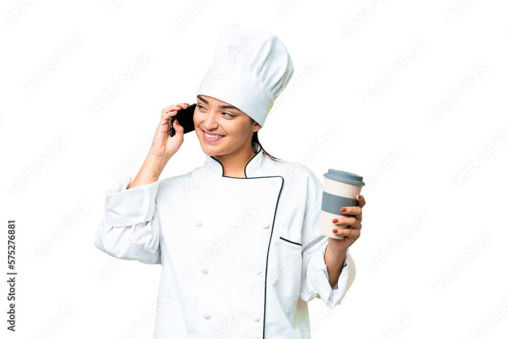 Young woman Chef over isolated chroma key background holding coffee to take away and a mobile Young woman Chef over isolated chroma key background holding coffee to take away and a mobile