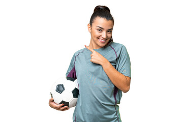 Young football player Woman over isolated chroma key background pointing to the side to present a product