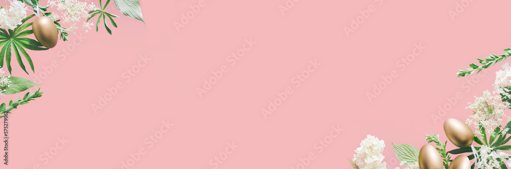 Golden Easter eggs in assorted floral and jungle tree green leaves and white flowers corner border on peach pink. Natural sustainable environment friendly cosmetics mockup flat lay banner