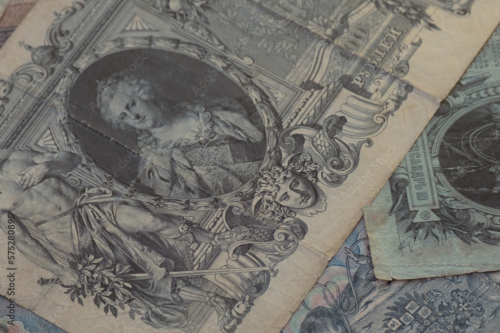 Old paper money of the Russian Empire of the 19th century background. Retro banknote of Russian empire. Сlose-up of old banknotes of the tsarist Russian empire. Antiques money, royal rubles