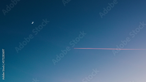 Airplane trail in the blue sky