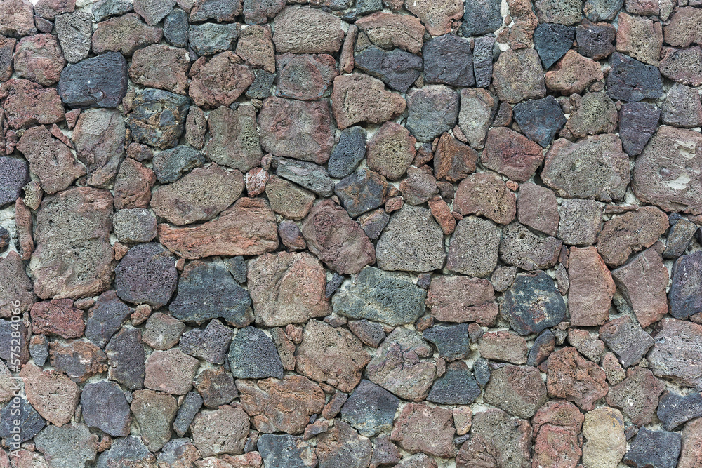 Wall of stones of different shapes and sizes Wall of stones of different shapes and sizes