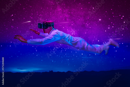 mind of man expand him to fly limitless through space  with VR glasses project a breathtaking view of cosmos when he float weightlessly among stars and marvel at wonders of universe