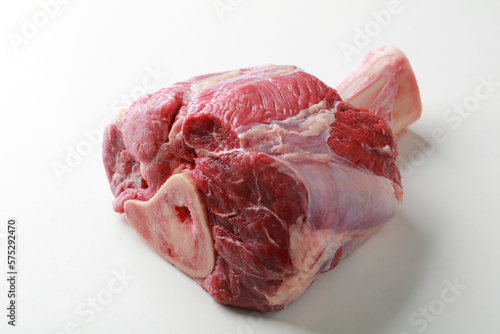 Raw veal shank on a bone against white