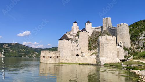 Obraz na plátně The historic medieval Golubac Fortress situated directly on the banks of the Danube River, featuring stone towers, defensive walls