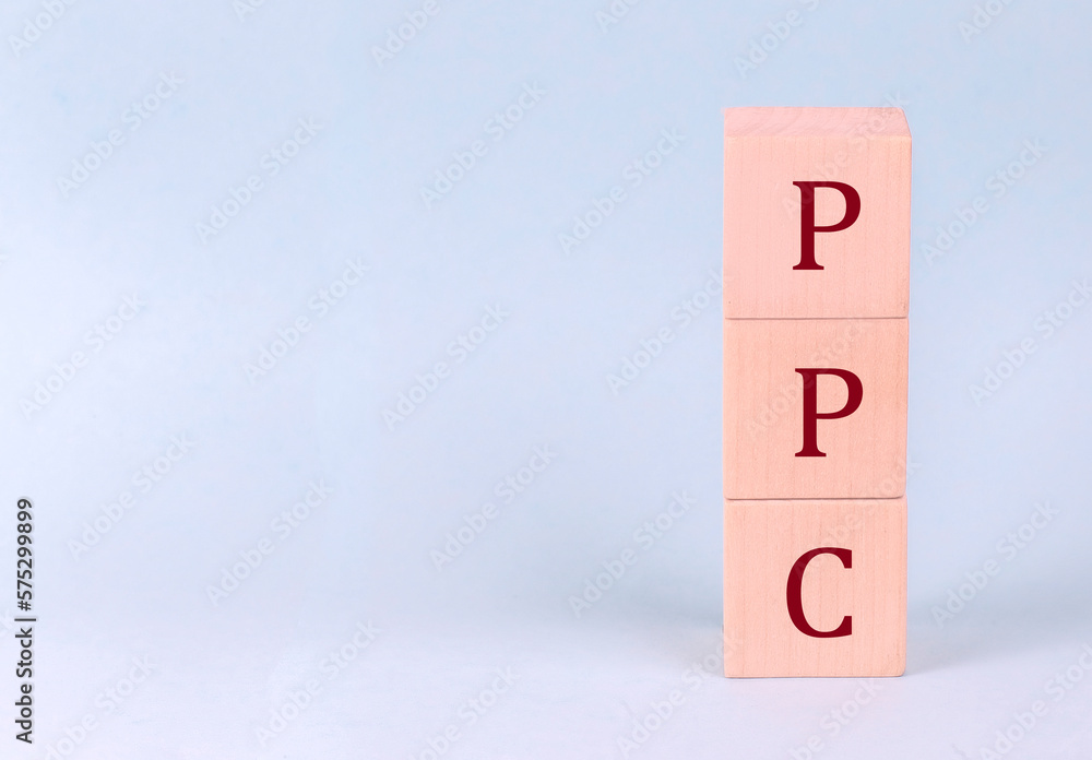 PPC on wooden cubes on a blue background PPC on wooden cubes on a blue background