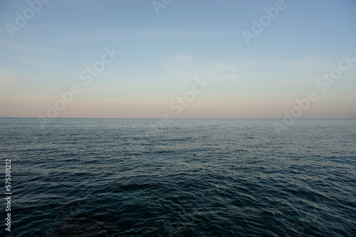 Aegean Sea in Crete. White clouds and blue sky. Sea distances and the horizon. 