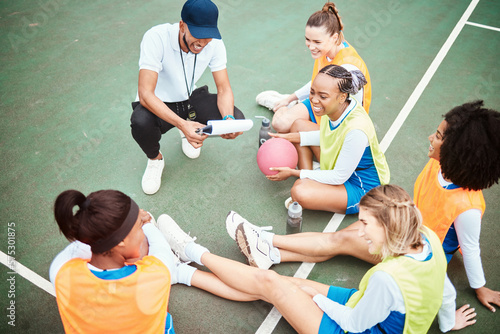 Netball plan, sports team smile and coach planning game strategy, teamwork collaboration or explain competition idea. Coaching athlete, top view or talking group of people listen to fitness challenge