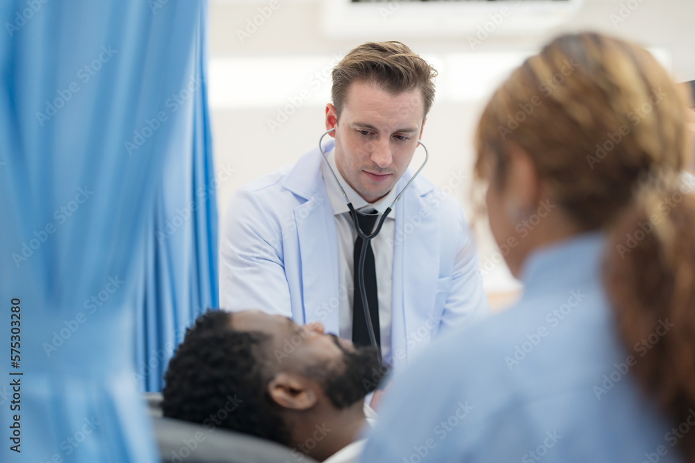 Doctor checking heart rate of male. Doctor checking heart rate of male.