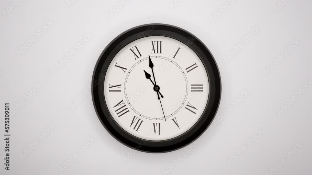 The Time On The Clock Eleven. White Wall Clock With Black Rim And Black Hands. Timelapse. 4k, ProRes The Time On The Clock Eleven. White Wall Clock With Black Rim And Black Hands. Timelapse. 4k, ProRes