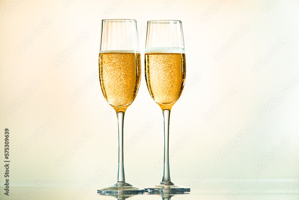 Minimalist image of two glasses of champagne with light tones