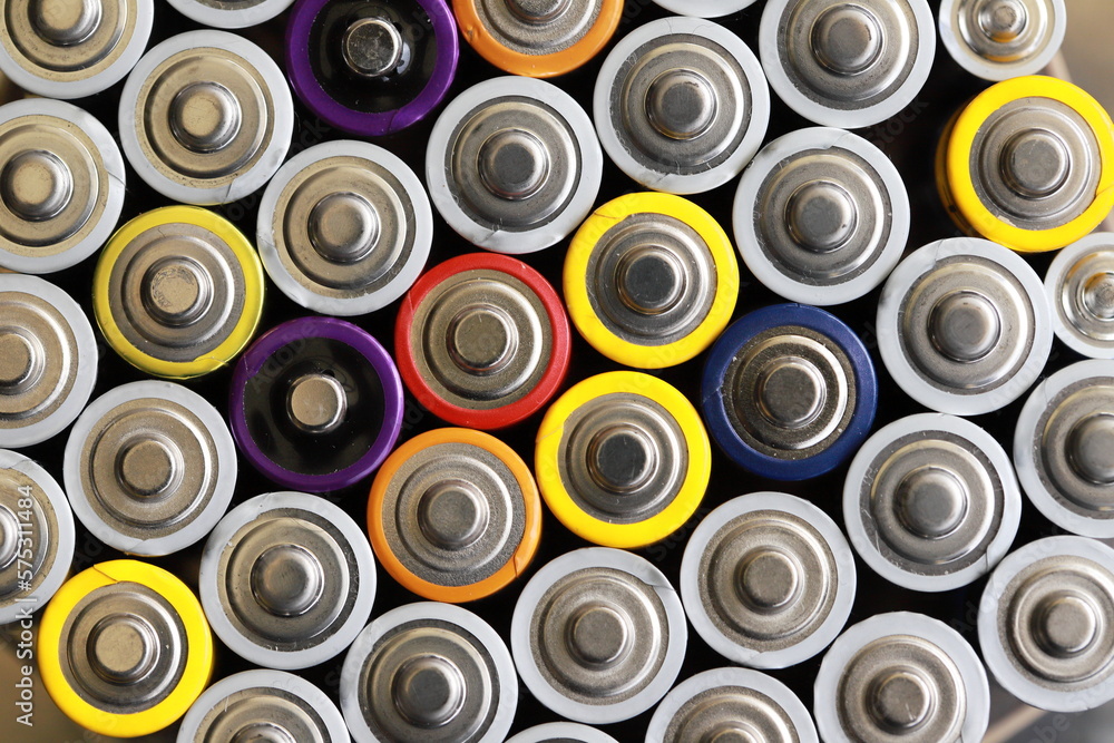 many round batteries and one red battery many round batteries and one red battery