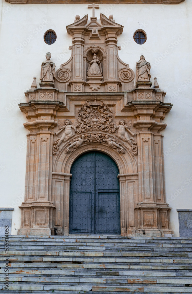 detail view of the ornate Baroque entrance and door of the Sanctuary of our Lady of the Holy Fountain in Murcia