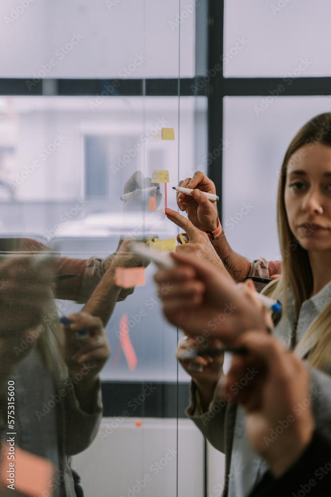 Sticking and writing sticky notes over glass wall Sticking and writing sticky notes over glass wall