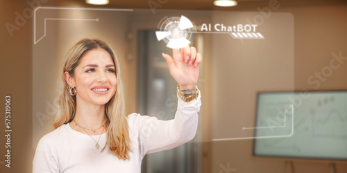 A young woman is touching a transparent futuristic screen on which the inscription AI Chat Bot can be seen