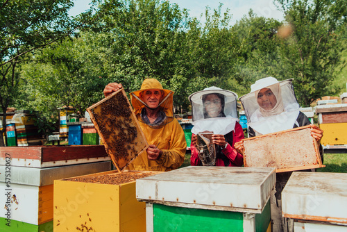 Arab investors checking the quality of honey on a large bee farm in which they have invested their money. The concept of investing in small businesses