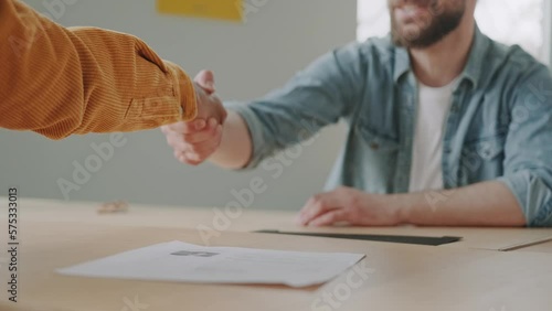 clouse up handshake HR managers satisfied about male job employee, have positive first impression of candidate.