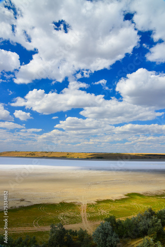 Kuyalnitsky estuary - a salt desert on the site of a drying pond, white thunderclouds before the rain. Ecological problem of the south of Ukraine