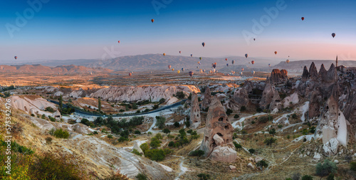 Amazing panoramic aerial view of hot air balloons at sunrise in Goreme National Park.Uchisar Castle. Cappadocia.Turkey. Top attraction travel destinations.