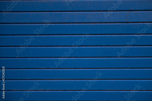 Blue metal texture with shutter and lines.