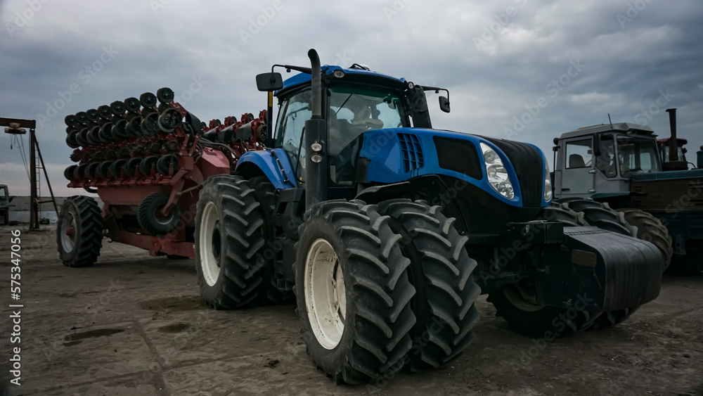 Blue powerful tractor at the farm Blue powerful tractor at the farm