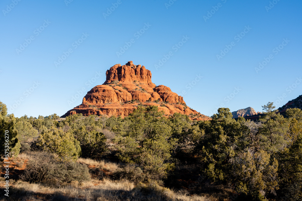 Landscape view of Bell Rock in Sedona Arizona In the morning sun. Beautiful B red rock formation viewed from the Bell Rock Trail. Landscape view of Bell Rock in Sedona Arizona In the morning sun. Beautiful B red rock formation viewed from the Bell Rock Trail.