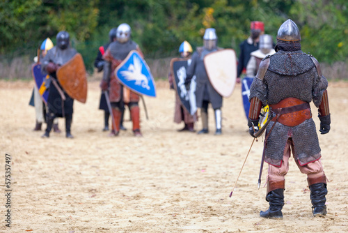 Archer facing a group of knights ready for battle