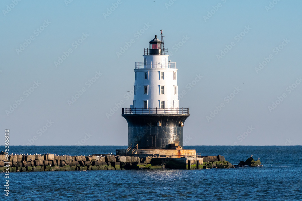 The National Harbor of Refuge Light is a lighthouse built on the ocean end of the outer Delaware Breakwater at the mouth of the Delaware Bay, just off Cape Henlopen.