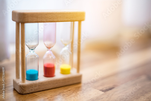 Colorful hourglasses with blurred background cute concept