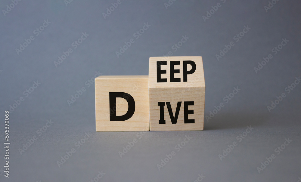 Deep Dive symbol. Concept words deep dive on wooden cubes. Beautiful grey background. Business and Deep Dive concept. Copy space Deep Dive symbol. Concept words deep dive on wooden cubes. Beautiful grey background. Business and Deep Dive concept. Copy space