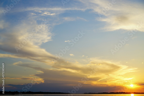 Expressive summer sunset on the Volga river. © I