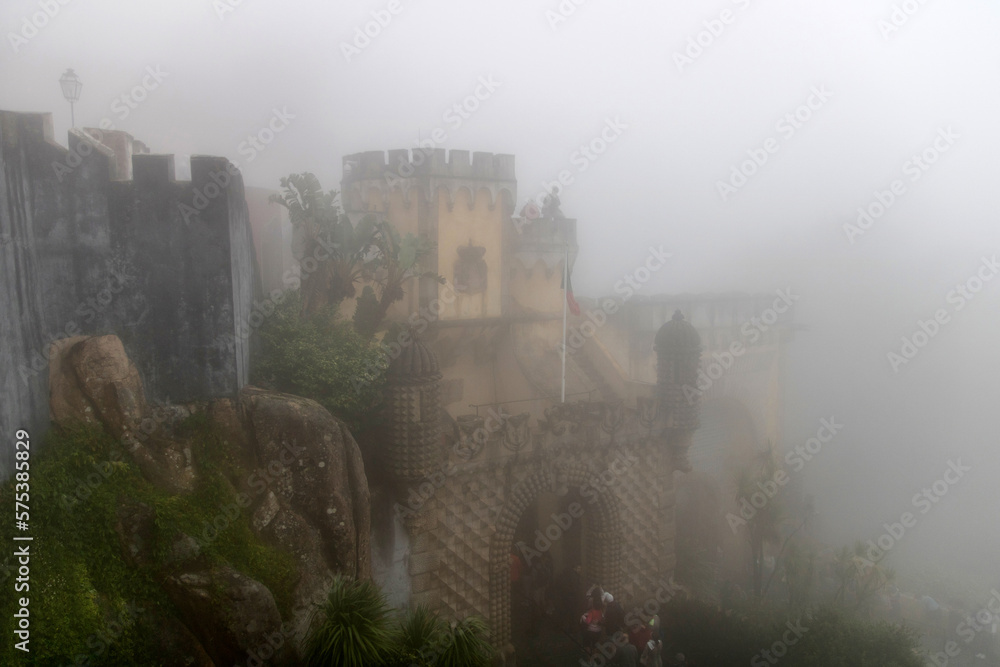Entrance of Pena Palace on a foggy day in Sintra Portugal