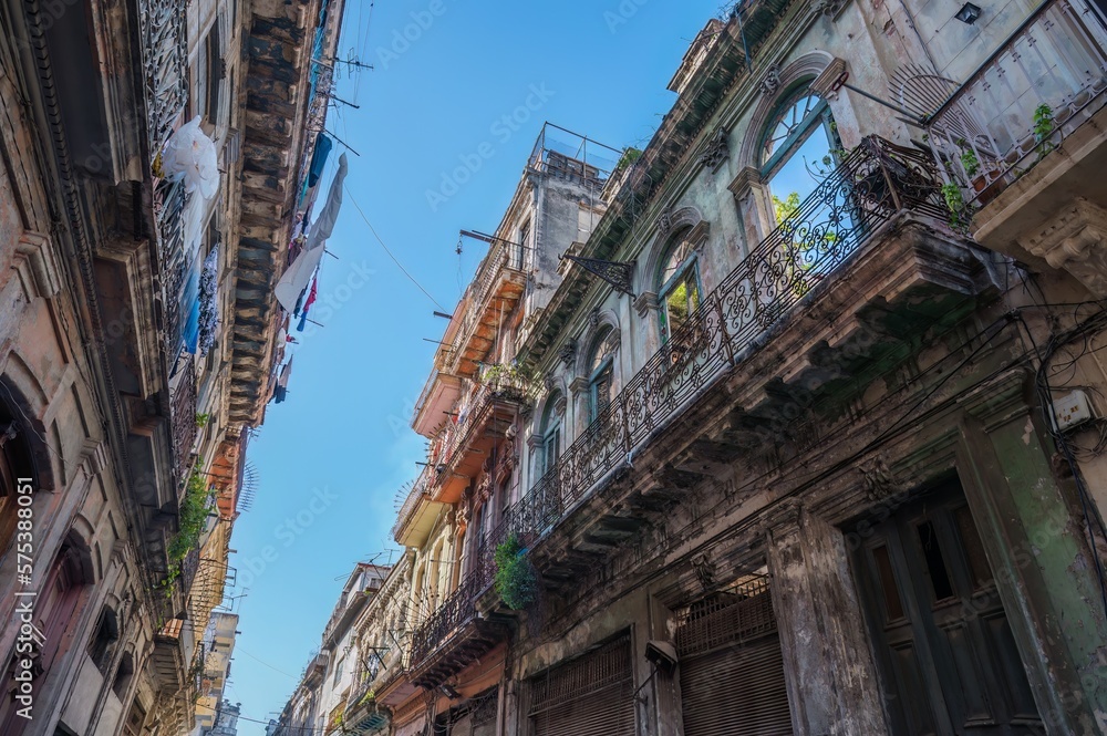 Architecture of Old Havana in Cuba. Everyday life with cars, houses and people.