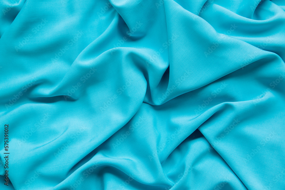 Fototapeta premium Background from turquoise fabric. The texture of the fabric.