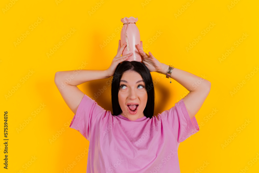Charming joyful girl posing and express emotions against a bright orange background. People emotions, Fun and carefree self-expression.