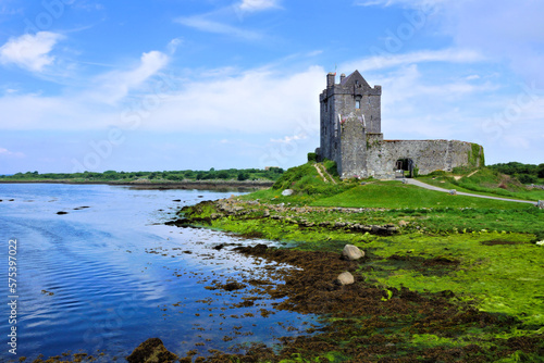 View of the medieval Dunguaire Castle along the shore of Galway Bay, Ireland