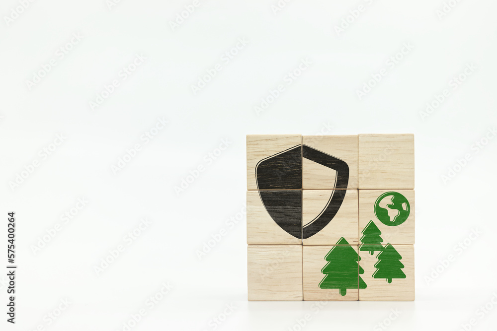 shield front of tree and earth globe icons on wooden block cubes on white background shield front of tree and earth globe icons on wooden block cubes on white background