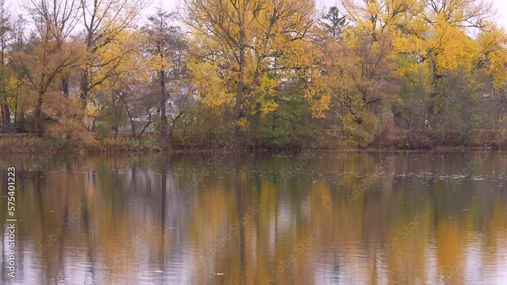 Autumn Colors and Landscape with Reflection on Water. Beautiful Autumn Scene in Lithuania, Europe Autumn Colors and Landscape with Reflection on Water. Beautiful Autumn Scene in Lithuania, Europe