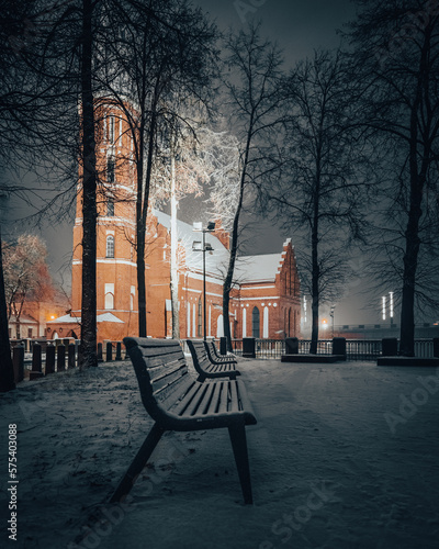 bench at night near the church
