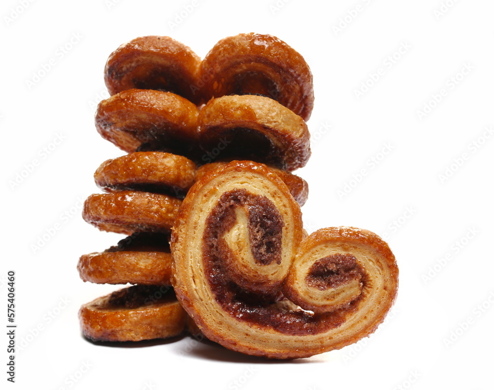 Puff pastry with butter and cinnamon isolated on white, side view Puff pastry with butter and cinnamon isolated on white, side view