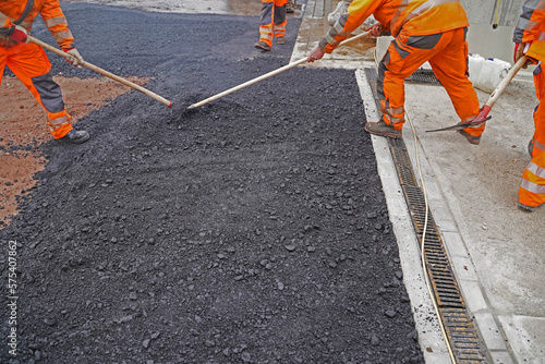 Asphalting of a new road on a construction site housing construc