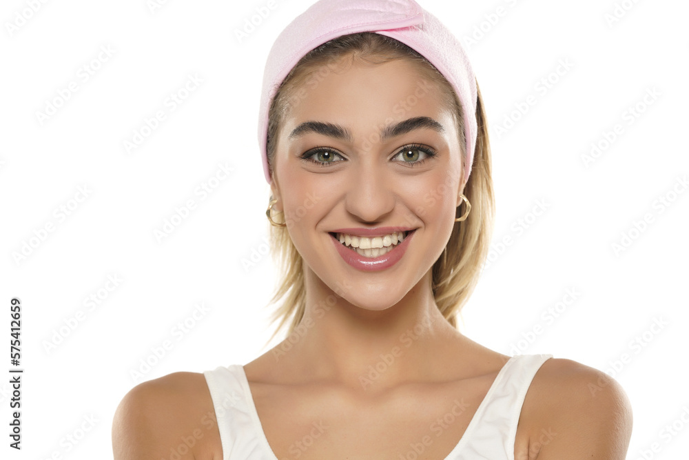 Close up portrait of beautiful young smiling woman face on a white background Close up portrait of beautiful young smiling woman face on a white background