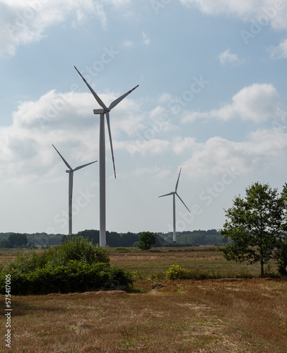 Koszalin, Poland - August 25, 2022: Wind turbines. Green energy from wind. Electricity generating windmills.