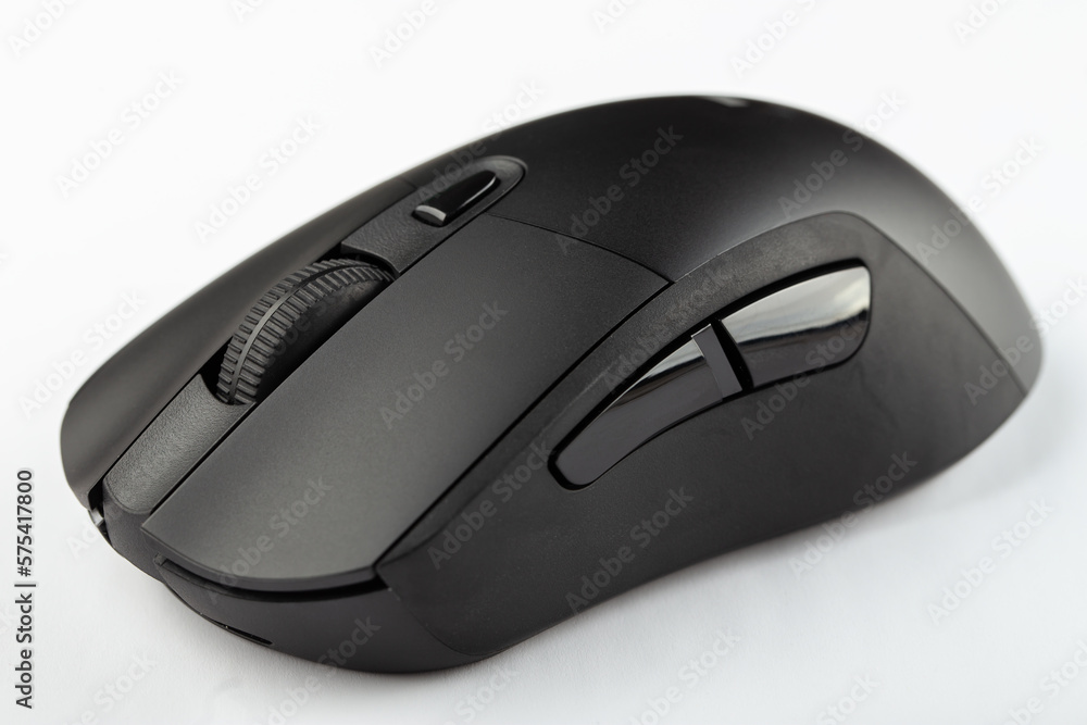 Black wireless computer mouse on a white background. Black wireless computer mouse on a white background.